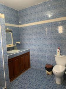 a bathroom with a toilet and a sink at Villa Duchesse in Sali Nianiaral +21 photos