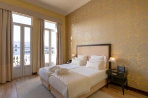 Cama ou camas em um quarto em Hotel Inglaterra - Charme & Boutique