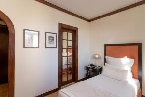 Cama ou camas em um quarto em Hotel Inglaterra - Charme & Boutique