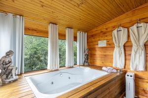 Vannituba majutusasutuses Estrela Polar Chalé com Hidro - Urubici +60 fotot