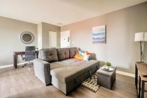 a living room with a couch and a table at Newly Renovated 2BR Unit in Glenview West in Hamilton