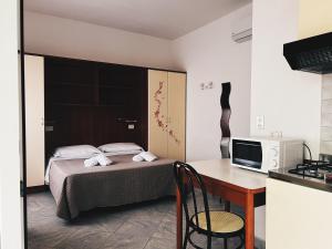 Ένα ή περισσότερα κρεβάτια σε δωμάτιο στο Residence Buena Vista