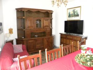 a living room with a couch and a entertainment center at La Casa del Corso in Alberobello