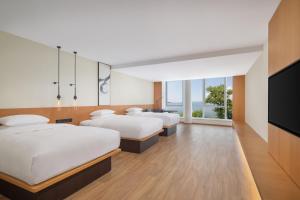 Ein Bett oder Betten in einem Zimmer der Unterkunft Fairfield by Marriott Hangzhou Qiandao Lake