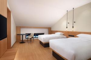 Ein Bett oder Betten in einem Zimmer der Unterkunft Fairfield by Marriott Hangzhou Qiandao Lake