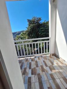 a balcony with a view of the ocean at Hospedagem Recanto dos Anjos in Arraial do Cabo