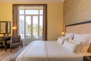 Cama ou camas em um quarto em Hotel Inglaterra - Charme & Boutique