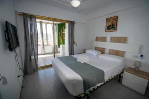 A bed or beds in a room at Don Miguel II 18-G Levante Beach