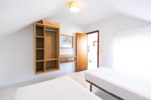 Posteľ alebo postele v izbe v ubytovaní Apartamentos Regollera