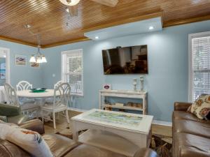 a living room with a couch and a table at Cozy Beach House by Newman-Dailey in Destin