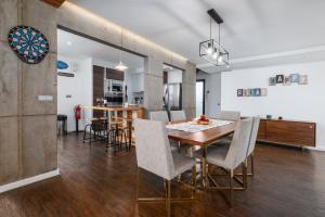 a kitchen and dining room with a table and chairs at TableTop in São Roque