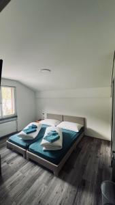 Voodi või voodid majutusasutuse Hotel Péz Ault toas
