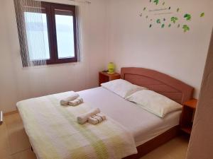 Postel nebo postele na pokoji v ubytování Apartment Matea + 17 fotografií