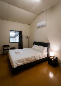 Postel nebo postele na pokoji v ubytování Aayu Beach St George Town Penang