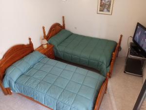 Ένα ή περισσότερα κρεβάτια σε δωμάτιο στο Habitación Privada Doble Toledo