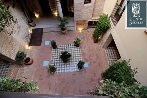 an overhead view of a courtyard with potted plants at Patio de los Ángeles in Toledo