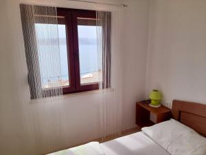 Postel nebo postele na pokoji v ubytování Apartment Matea