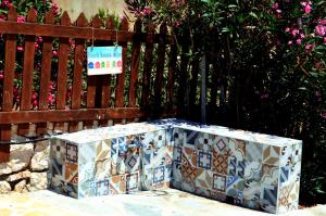a box sitting on the ground next to a fence at Villa Aristoteles in Halki