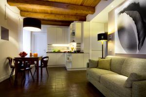 a living room with a couch and a table at La Gensola In Trastevere in Rome