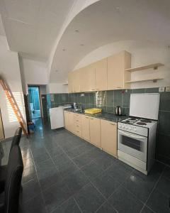 Kuchyň nebo kuchyňský kout v ubytování Apartmani Arma