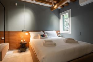 Ένα ή περισσότερα κρεβάτια σε δωμάτιο στο Venice Jewel Canal View by Wonderful Italy