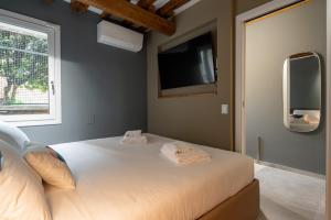 Ένα ή περισσότερα κρεβάτια σε δωμάτιο στο Venice Jewel Canal View by Wonderful Italy