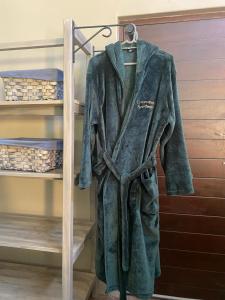 a robe is hanging on a rack at Stacey's Cornerstone Studio Apartment in Hillcrest