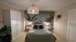 A bed or beds in a room at Santa Lucia Affittacamere