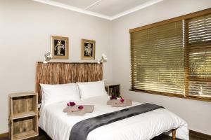a bedroom with a bed with two stuffed animals on it at Estuary Breeze in Sedgefield