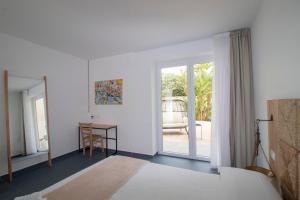 Postel nebo postele na pokoji v ubytování Hotel Arte Mare