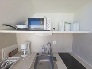 Kuchyň nebo kuchyňský kout v ubytování NEW ! Appartements avec piscine et plages accessibles à pieds