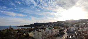 a view of a city with buildings and the water at Letos Apartment Sky in Kavála
