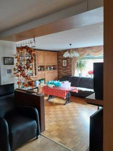a living room with a couch and a table at Haus Sonnenschein in Trogen