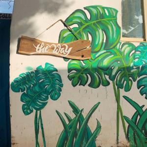 a wall with a painting of a bunch of bananas at The Way Hostel 4 persons Room in Dahab