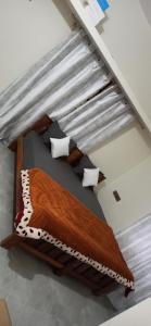 a bed in a room with at COORG WINDYSIDE HOMESTAY With Campfire PAID in Madikeri