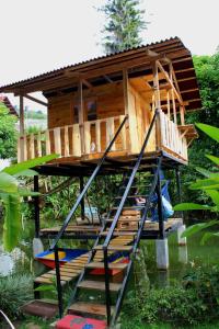 a tree house in the middle of the water at Aventura Treehouse Glamping in Palmira