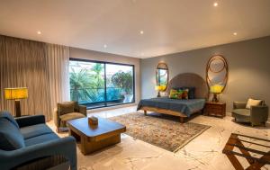 a large living room with a couch and a table at Amorzito by Solitaire Stays in Dona Paula +81 photos