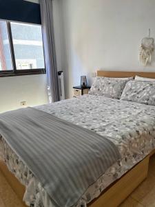Posteľ alebo postele v izbe v ubytovaní BKD1 - Apartamento entero a 50 metros PLAYA DE LAS CANTERAS