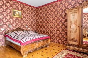 Postel nebo postele na pokoji v ubytování Fried Kastély Hotel Simontornya
