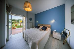 a bedroom with a bed and a sliding glass door at la belavista in Izola +86 photos