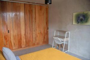Postel nebo postele na pokoji v ubytování Maison Mindo