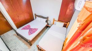 Postel nebo postele na pokoji v ubytování Hotel Casa Telma