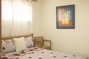 Postel nebo postele na pokoji v ubytování Hotel Casa Telma