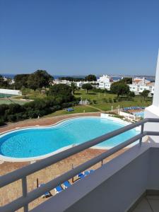 a view of a swimming pool from a balcony at Prainha Clube in Alvor