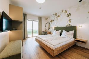 Ένα ή περισσότερα κρεβάτια σε δωμάτιο στο Weingut Radl