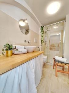 a bathroom with a sink and a toilet at Dimora Barbacana in Monopoli +16 photos