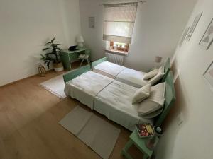 a bedroom with a large bed in a room at All'ombra del tiglio Bed&Breakfast in Doberdò del Lago