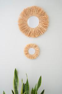 a pair of faux fur wreaths next to a plant at Los Áticos in Estepona +19 photos