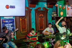 a group of people playing music in a bar at Skeffington Arms Hotel in Galway
