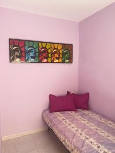a bedroom with a bed with a stained glass window at Paraiso MEDITERRANEO in Puerto Marino